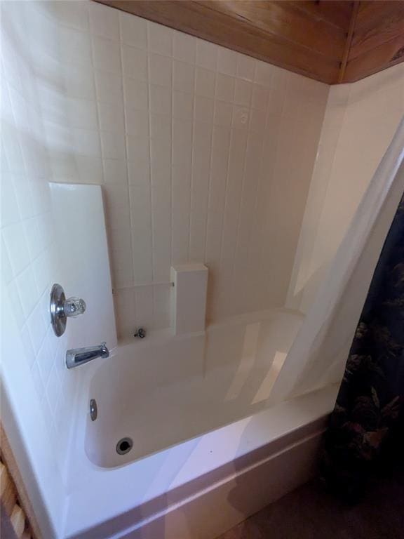 bathroom featuring shower / bathtub combination with curtain