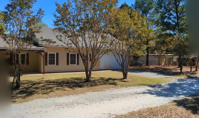 view of side of home with a garage