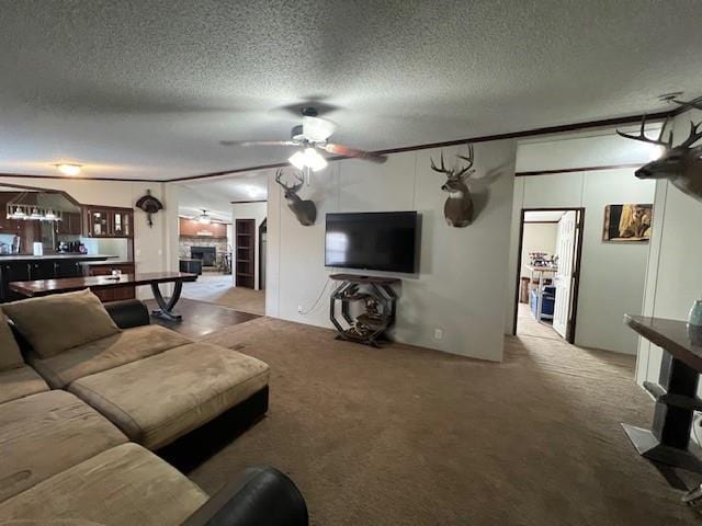 carpeted living room featuring ceiling fan, a textured ceiling, and indoor bar