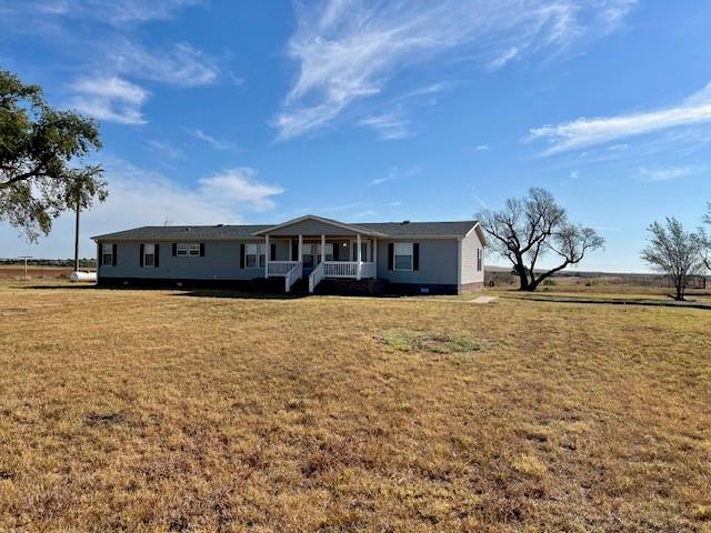 ranch-style house with a porch and a front yard