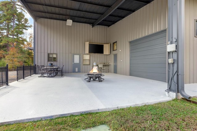 view of patio / terrace featuring an outdoor fire pit