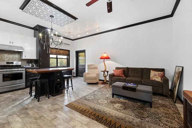 living room featuring ceiling fan with notable chandelier and ornamental molding