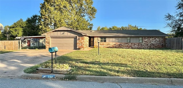 ranch-style home with a carport, a garage, and a front lawn