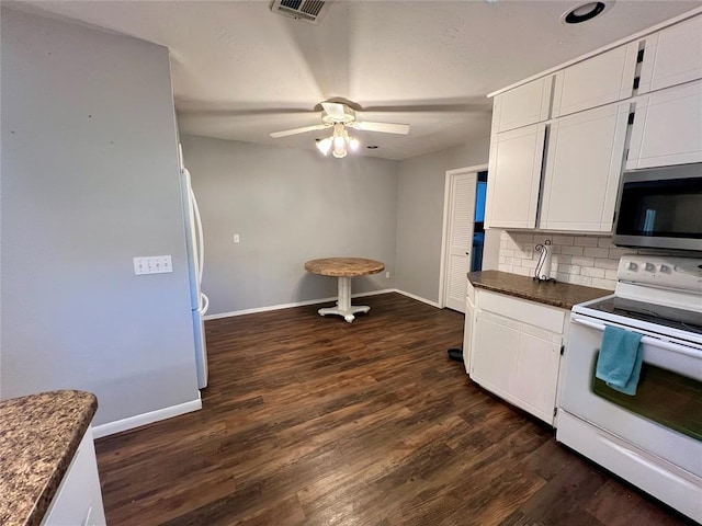 kitchen featuring white appliances, backsplash, dark hardwood / wood-style floors, ceiling fan, and white cabinetry