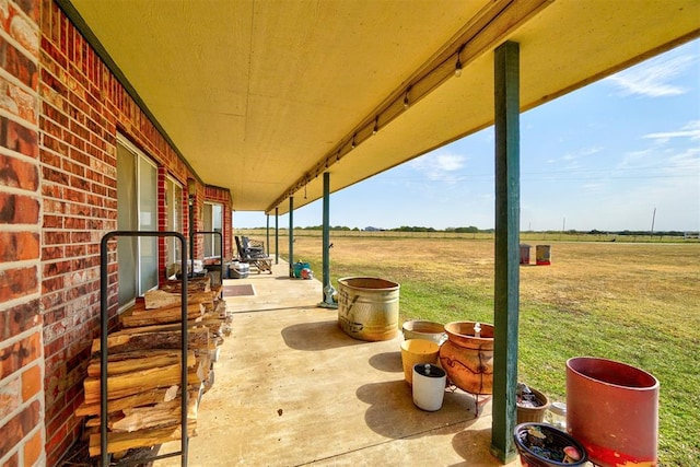 view of patio / terrace with a rural view