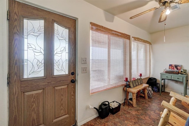 entrance foyer with carpet flooring, a wealth of natural light, and ceiling fan