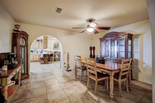 dining area featuring ceiling fan and light tile patterned floors