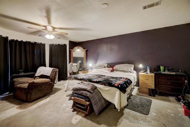 bedroom featuring ceiling fan and a textured ceiling