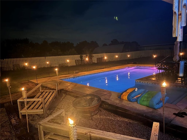 view of pool at night