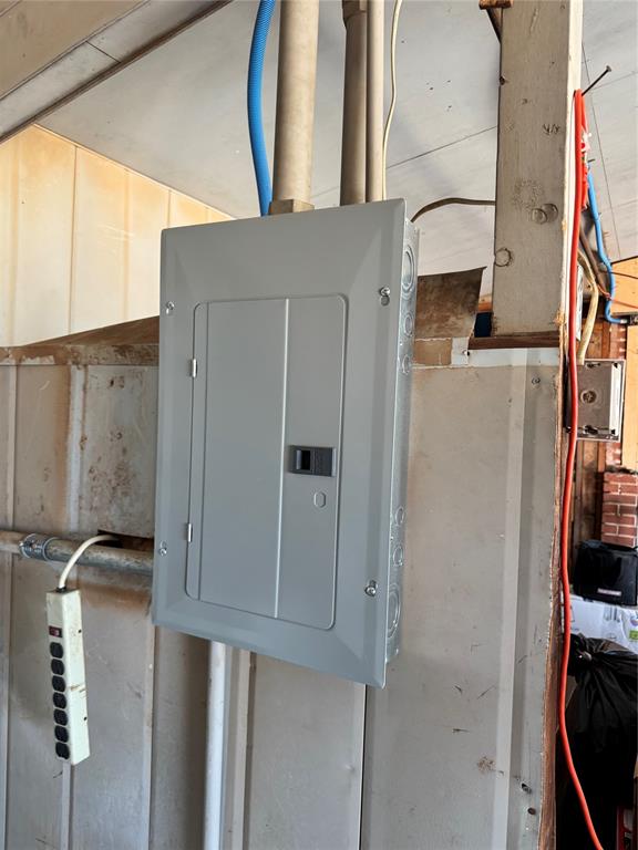 utility room featuring electric panel