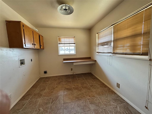 laundry room with cabinets, hookup for a washing machine, and electric dryer hookup