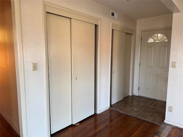 entryway featuring dark wood-type flooring