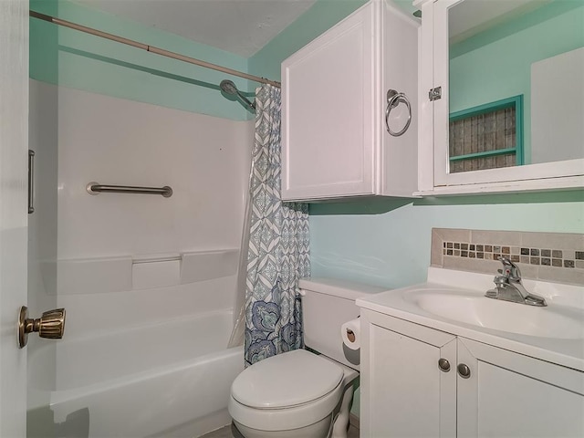 full bathroom with vanity, shower / bath combo, and toilet