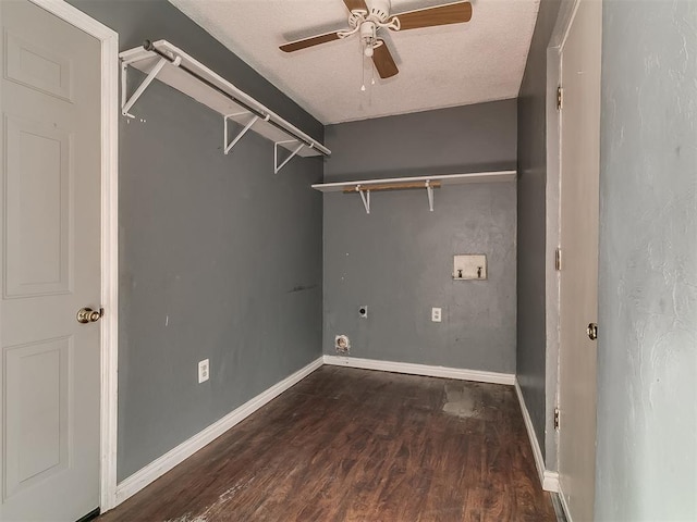 laundry room featuring ceiling fan, dark wood-type flooring, hookup for an electric dryer, hookup for a washing machine, and a textured ceiling