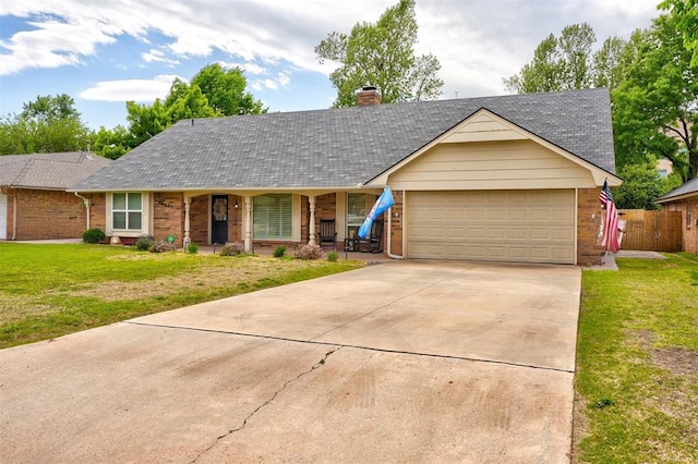 ranch-style house with a front yard, a garage, and covered porch