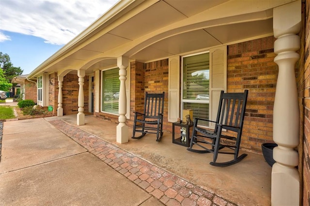 view of patio featuring a porch