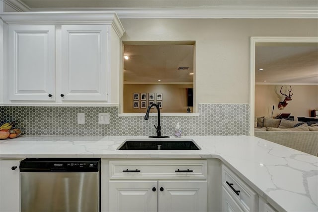 kitchen featuring dishwasher, white cabinetry, light stone countertops, and sink