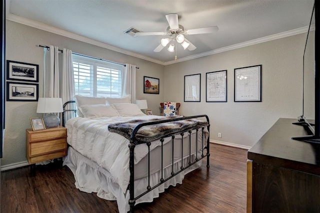 bedroom featuring dark hardwood / wood-style flooring, ceiling fan, and crown molding