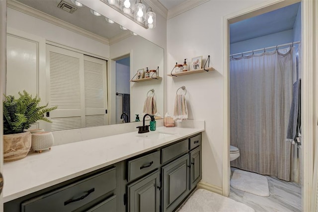 bathroom with vanity, toilet, and crown molding