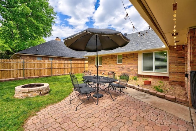 view of patio with a fire pit