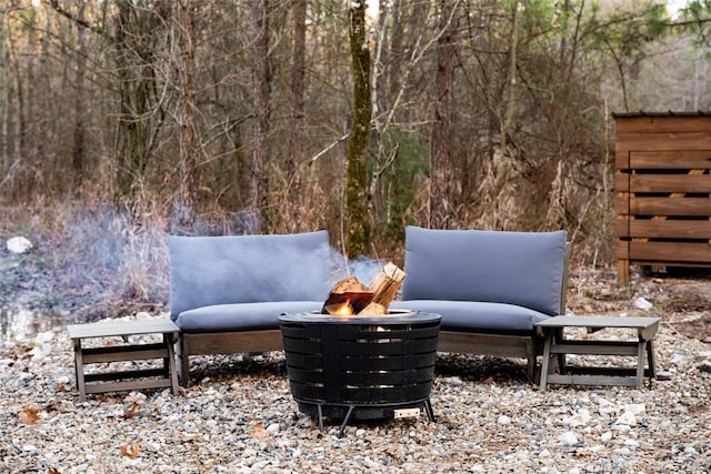 view of patio with a fire pit