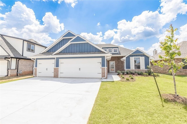 16025 Coneflower Dr, Edmond, OK 73013 - view of front facade featuring board and batten siding, an attached garage, brick siding, concrete driveway, and a front yard