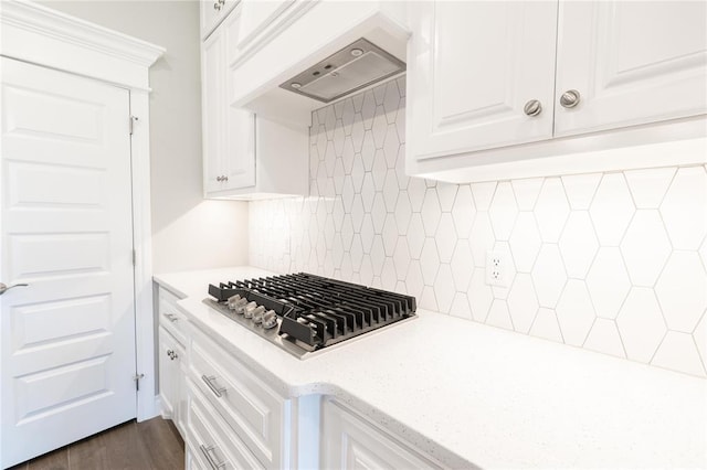 16025 Coneflower Dr, Edmond, OK 73013 - kitchen featuring stainless steel gas stovetop, custom range hood, white cabinetry, tasteful backsplash, and dark wood-style floors