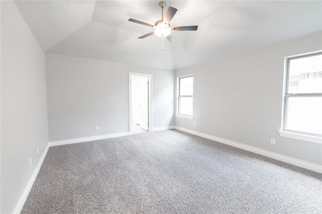 16025 Coneflower Dr, Edmond, OK 73013 - carpeted empty room featuring vaulted ceiling, a ceiling fan, and baseboards