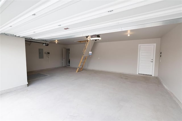 16025 Coneflower Dr, Edmond, OK 73013 - garage with electric panel, a garage door opener, and baseboards