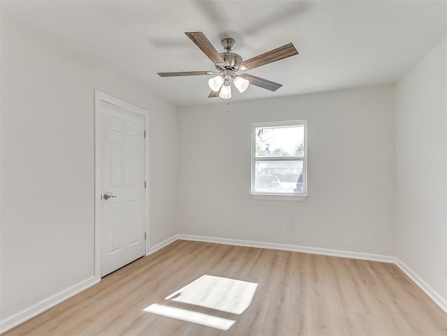 spare room featuring ceiling fan and light hardwood / wood-style flooring