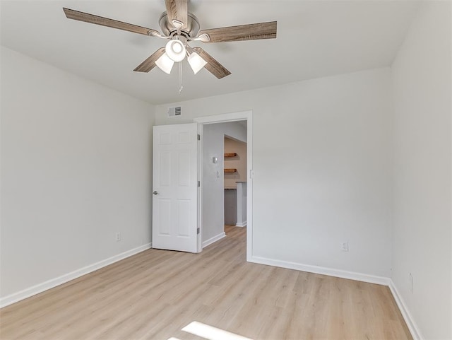 unfurnished room featuring ceiling fan and light hardwood / wood-style floors