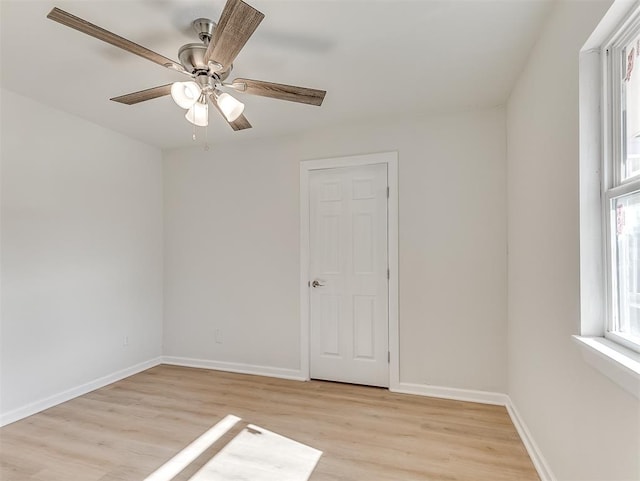 unfurnished room featuring ceiling fan and light hardwood / wood-style flooring