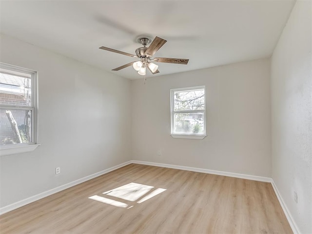 empty room featuring ceiling fan and light hardwood / wood-style flooring