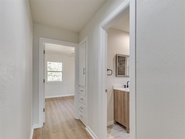 corridor featuring light hardwood / wood-style flooring