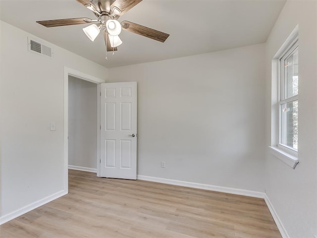 unfurnished room with ceiling fan and light hardwood / wood-style floors