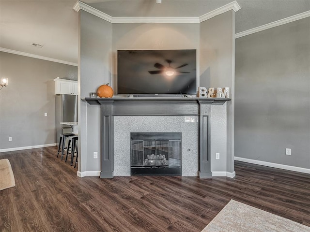 details featuring wood-type flooring, a tile fireplace, and crown molding