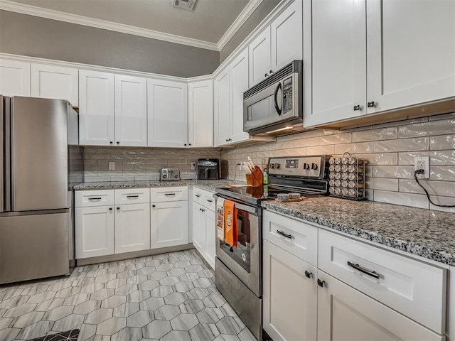 kitchen featuring tasteful backsplash, appliances with stainless steel finishes, crown molding, and white cabinetry