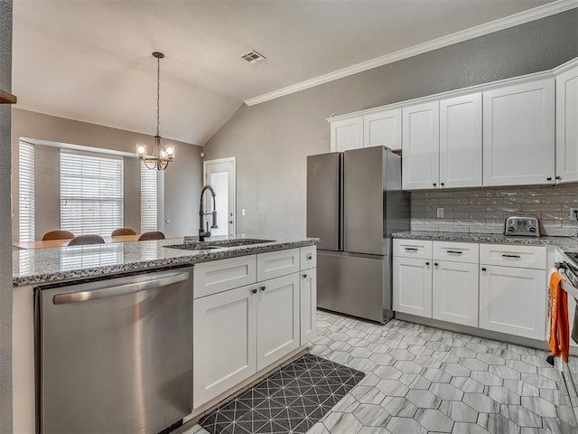 kitchen featuring sink, white cabinets, stainless steel appliances, and lofted ceiling