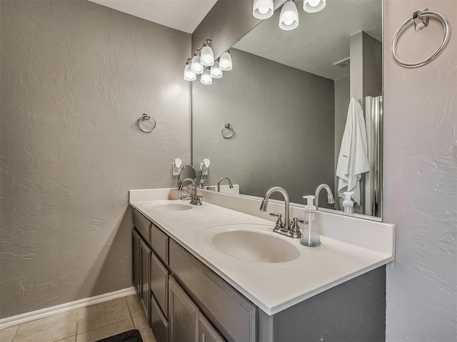 bathroom with tile patterned flooring and vanity