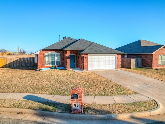 ranch-style house with a garage and a front yard