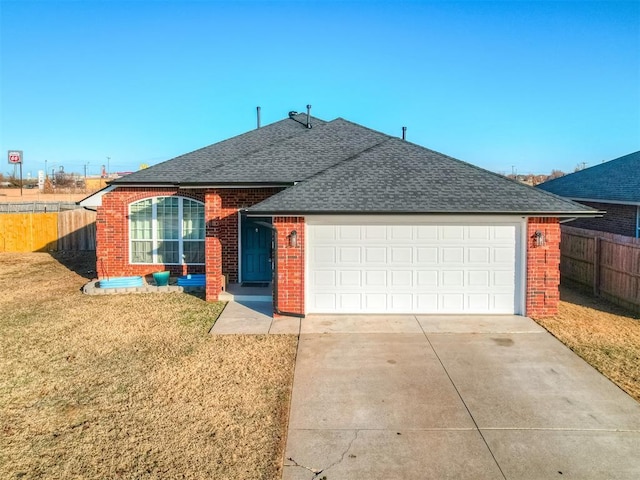 ranch-style house with a front yard and a garage