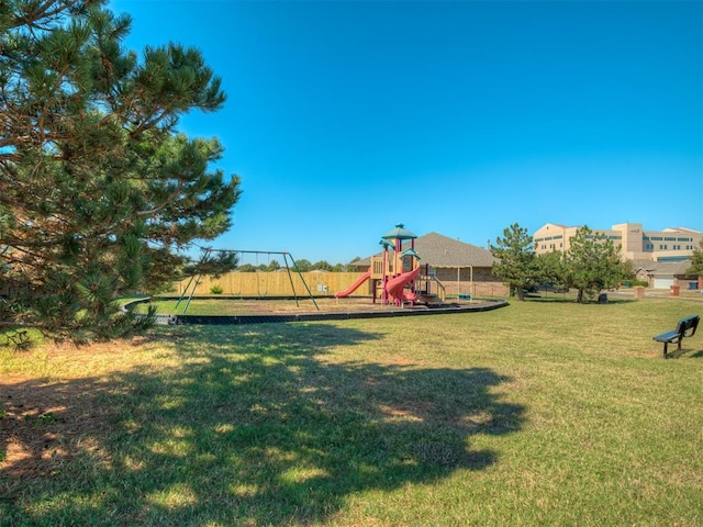 view of jungle gym featuring a lawn