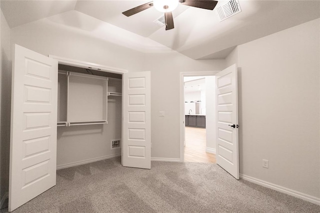 9201 Lupine Rd, Yukon, OK 73099 - unfurnished bedroom with carpet floors, a closet, baseboards, a ceiling fan, and vaulted ceiling