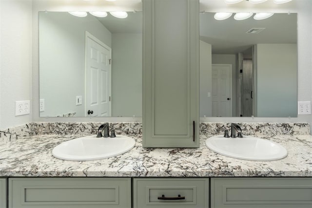 bathroom featuring vanity and backsplash