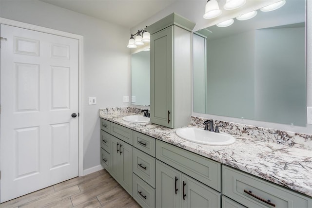 bathroom with hardwood / wood-style flooring and vanity