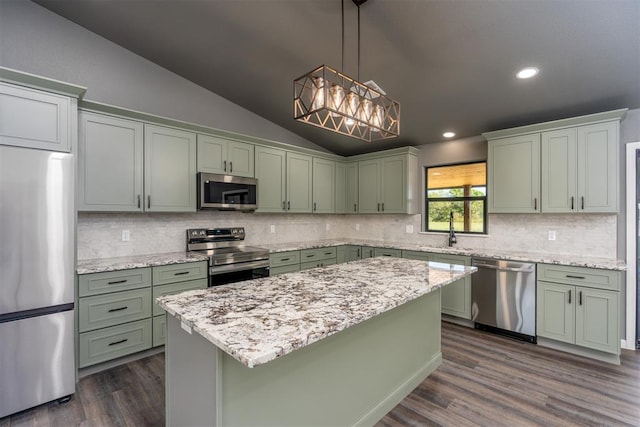 kitchen with sink, hanging light fixtures, dark hardwood / wood-style flooring, lofted ceiling, and appliances with stainless steel finishes