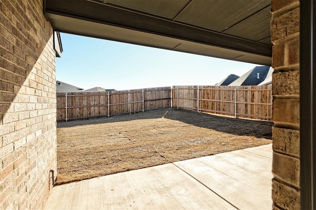 view of yard with a patio area and a fenced backyard