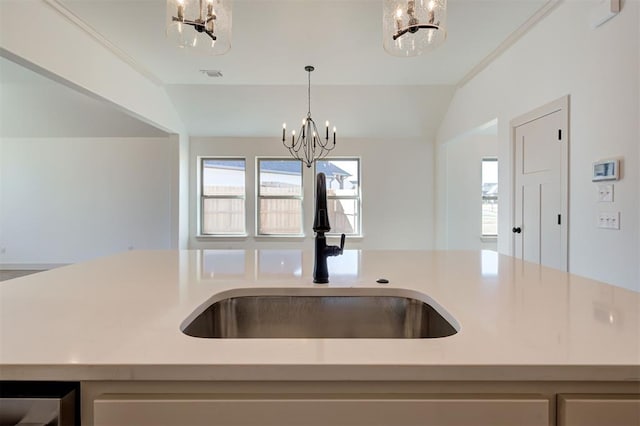 kitchen with plenty of natural light, visible vents, a sink, and an inviting chandelier