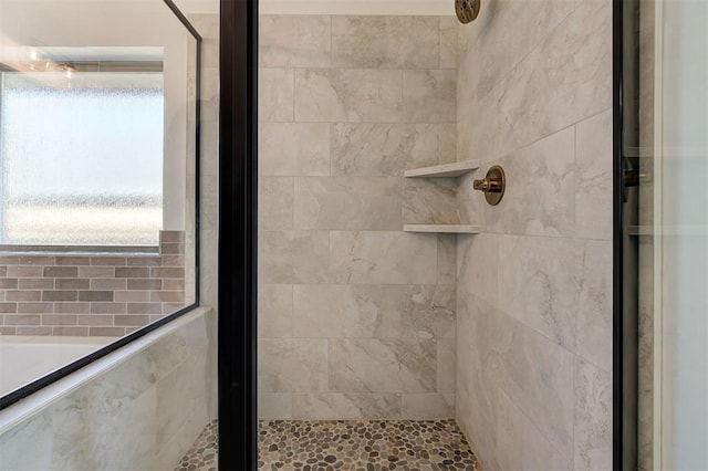 bathroom featuring a shower stall