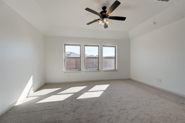 2216 Los Angeles Ave, Edmond, OK 73034 - spare room featuring light carpet, ceiling fan, and baseboards